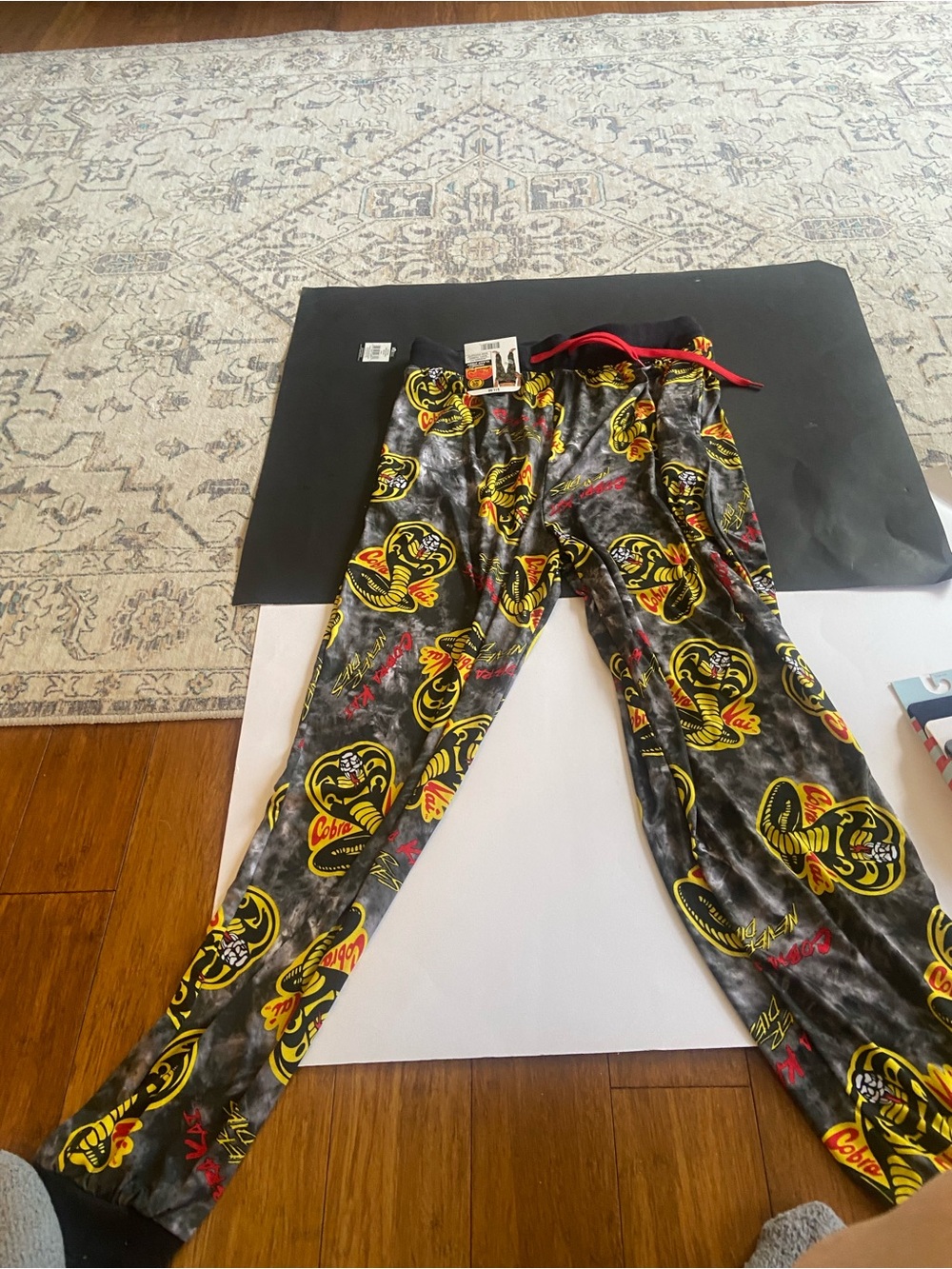 Cobra Kai Black Lounge Pants with Yellow & Red Cobra Print